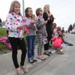 Photo by Kelly Sullivan/ Peninsula Clarion A group of onlookers watch the start of Kenai's July 4th Parade on Monday, July 4, 2016 in Kenai, Alaska.
