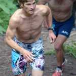 Mount Marathon men's champion David Norris leads Alaska Pacific University ski program teammate Scott Patterson up the lower part of the mountain Monday in Seward.