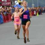 Photo by Jeff Helminiak/Peninsula Clarion Soldotna's Taylor Ostrander passes Anchorage's April McAnly for ninth place near the finish of the women's Mount Marathon race Monday in Seward.