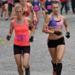 Photo by Jeff Helminiak/Peninsula Clarion Christy Marvin, the champion, and Denali Foldager-Strabel, the third-place finisher, lead the pack to the mountain Monday at the women's Mount Marathon race in Seward.