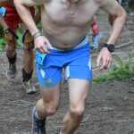 Photo by Jeff Helminiak/Peninsula Clarion Soldotna High School graduate Brent Knight powers up the lower mountain Monday on the way to an 18th-place finish at the men's Mount Marathon race in Seward.