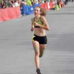 Photo by Jeff Helminiak/Peninsula Clarion Kenai Central junior Riana Boonstra finishes second in the junior girls race Monday in Seward.