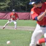 Photo by Joey Klecka/Peninsula Clarion Post 20 Twins Paul Steffensen keeps an eye on the ball while teammate Josh Darrow bats against Tennessee Post 19 in Thursday's championship game of the Bill Miller Big Fish Wood Bat tournament at the Kenai Little League fields.
