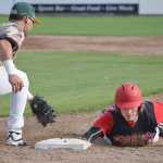 Photo by Joey Klecka/Peninsula Clarion Brody Wofford of the Peninsula Oilers tags first base beyond the outstretched glove of Mat-Su Miners' baseman Jake Scudder Saturday evening at Coral Seymour Memorial Park in Kenai.