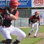 Photo by Joey Klecka/Peninsula Clarion Brody Wofford eyes Peninsula Oilers teammate Jeff Chapuran's swing against the Mat-Su Miners Saturday evening at Coral Seymour Memorial Park in Kenai.