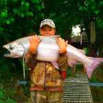 Photo courtesy Leon James Silas Phillips, 12, of Vale, Oregon, shows off the 40-pound, 41-inch Kenai River king salmon he caught off a dock July 5. This is Phillips' first king, James said.