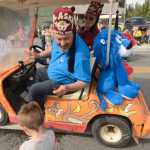 Ben Boettger/Peninsula Clarion Members of the Kenai-Soldotna Shriners Club distribute candy to children at the Soldotna Progress Days Parade on Saturday, July 25.