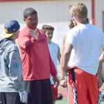 Photo by Jeff Helminiak/Peninsula Clarion Ex-NFL player Juaquin Iglesias instructs players during the passing portion of the Alaska All Star Football Camp at Kenai Central High School on Friday.