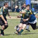 Photo by Jeff Helminiak/Peninsula Clarion Victor Rodriguez of the Kenai River Wolfpack bursts through a tackle while teammate Brian Johnson provides support Saturday at the Kenai Dipnet Fest Rugby 10s Tournament in Kenai.