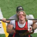 Photo by Jeff Helminiak/Peninsula Clarion Eli McDonald, who finished with the third Wilks Coefficient, squats at the USA Powerlifting Justin Maile Classic on Saturday at Justin Maile Field in Soldotna.