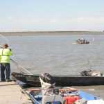 Boaters rescue passengers from a capsized boat in the Kenai River Tuesday during the personal-use dipnet fishery. (Photo courtesy Frank Alioto)