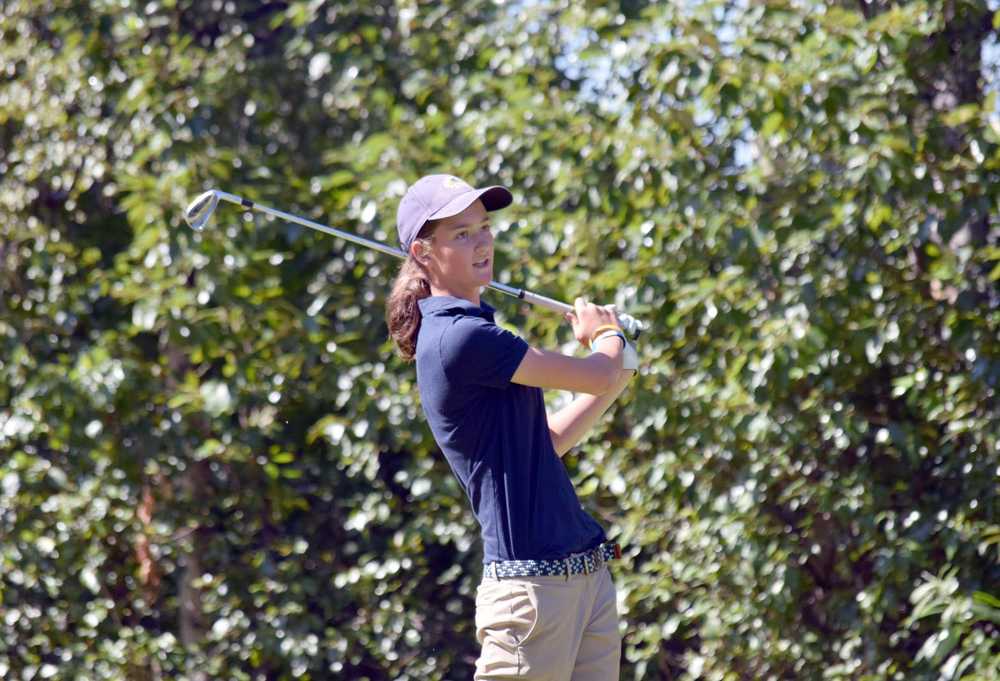 Photo by Jeff Helminiak/Peninsula Clarion Danica Schmidt, a sophomore at Soldotna High School, tees off on the 17th hole Tuesday during the Birch Ridge Jr Masters at Birch Ridge Golf Course.