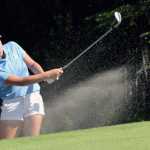 Photo by Jeff Helminiak/Peninsula Clarion Katelin Richards, a freshman at Kenai Central, blasts out of the bunker at the 15th hole Tuesday during the Birch Ridge Jr Masters at Birch Ridge Golf Course in Soldotna.