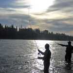 Photo by Elizabeth Earl/Peninsula Clarion Anglers cast on the banks of the Kenai River on Wednesday, July 20, 2016 in Soldotna, Alaska.