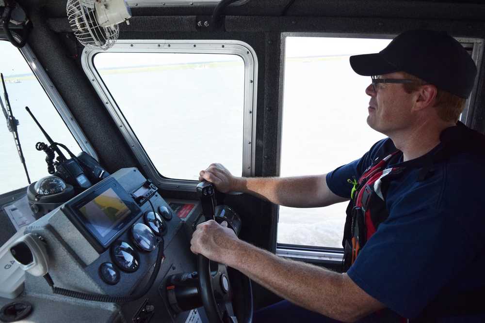 Photo by Megan Pacer/Peninsula Clarion Temporary Enforcement Officer Morgan Wensley, left, and Kenai Police Officer Morgan Ezell, enjoy the view while traversing the Kenai River in the department's patrol boat during the first no wake patrol of the dipnet season Tuesday, July 19, 2016 in Kenai, Alaska.