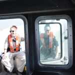 Photo by Megan Pacer/Peninsula Clarion Justin Horton, a senior firefighter with the Kenai Fire Department, takes a turn traversing the Kenai River in the department's patrol boat during the first no-wake patrol of the dipnet season Tuesday, July 19, 2016 in Kenai, Alaska.