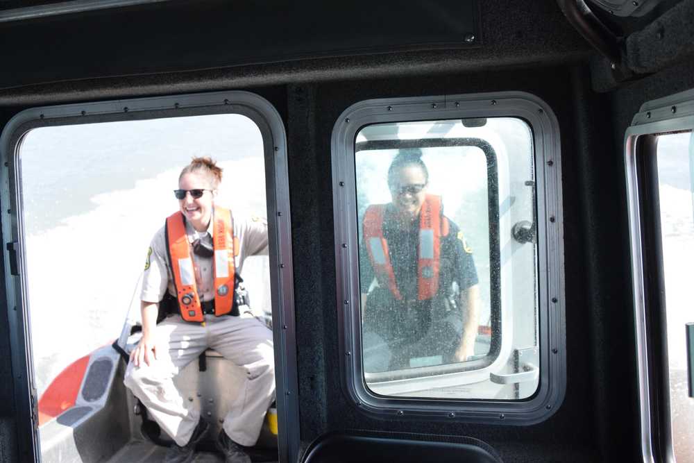 Photo by Megan Pacer/Peninsula Clarion Justin Horton, a senior firefighter with the Kenai Fire Department, takes a turn traversing the Kenai River in the department's patrol boat during the first no-wake patrol of the dipnet season Tuesday, July 19, 2016 in Kenai, Alaska.