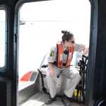 Photo by Megan Pacer/Peninsula Clarion Temporary Enforcement Officer Morgan Wensley talks with Kenai Police Officer Morgan Ezell while on the first no-wake patrol of the dipnet season Tuesday, July 19, 2016 in Kenai, Alaska, on the Kenai Fire Department's patrol boat.