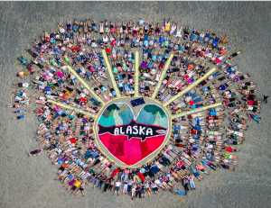 Hundreds of Salmonfest attendees became part of the art in the rodeo arena in August 2015. Homer artist Mavis Muller will return again this year to lead the 6th annual aerial group photo on Sat. Aug. 6 at 3 p.m.