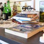 Photo by Megan Pacer/Peninsula Clarion Benjamin Farrer, 10, lends a hand and some hot glue to 7-year-old Justice Adcox while they make magic wands during a Harry Potter Birthday Bash on Friday, July 29, 2016 at the Kenai Community Library in Kenai, Alaska.
