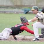 Peninsula Oilers infielder Alex Seifert slides back into first, under the tag of Mat-Su infielder Jake Scudder during a 2-1 victory over the Miners Saturday, July 30, 2016, at Hermon Brothers Field in Palmer.