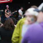 Members of Green Dot Homer hung up personal connection slips from bystander trainings they held Saturday, Aug. 6, 2016 at this year's Salmonfest in Ninilchik, Alaska. Personal connections are people's reasons for being part of interpersonal violence prevention, the members said.