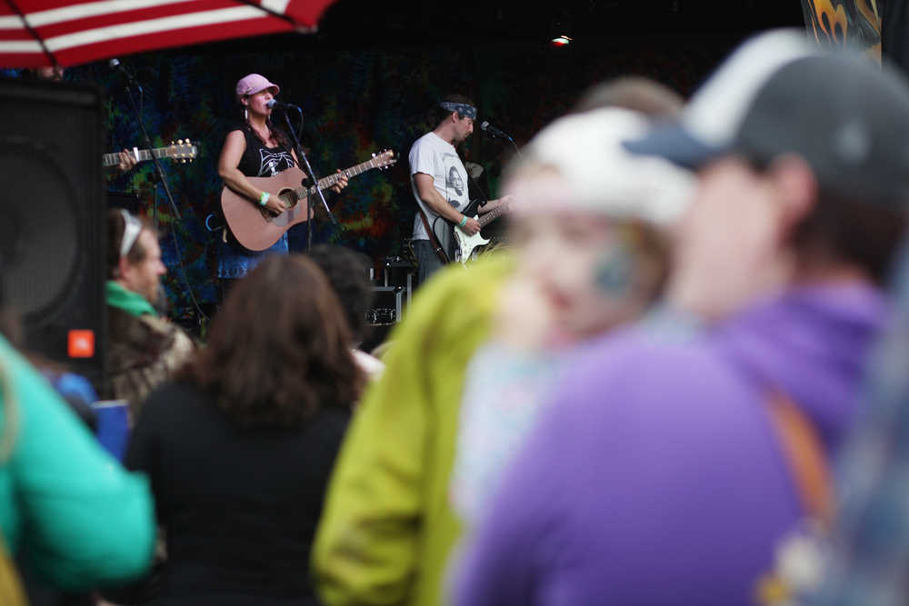 Members of Green Dot Homer hung up personal connection slips from bystander trainings they held Saturday, Aug. 6, 2016 at this year's Salmonfest in Ninilchik, Alaska. Personal connections are people's reasons for being part of interpersonal violence prevention, the members said.