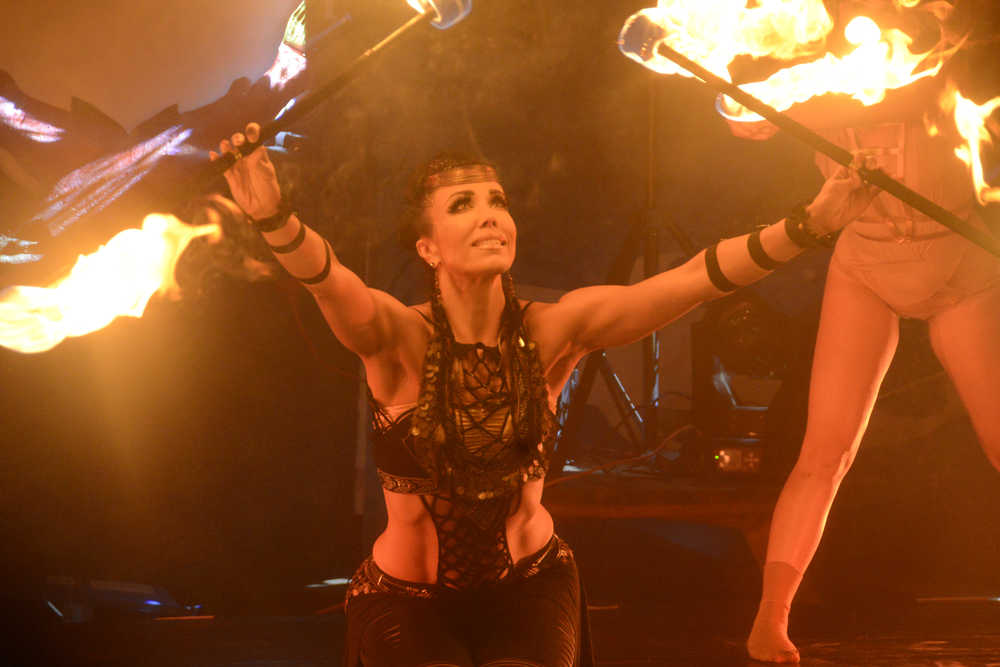 Photo by Megan Pacer/Peninsula Clarion Ishani Ishaya, a ballet, belly and fire dancer, performs with Quixotic on Sunday, Aug. 7, 2016 at Salmonfest in Ninilchik, Alaska. Quixotic is a cirque nouveau that blends live music with dance, lights and other performance art.