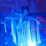 Photo by Megan Pacer/Peninsula Clarion A ballet dancer performs with Quixotic on Sunday, Aug. 7, 2016 at Salmonfest in Ninilchik, Alaska. Quixotic is a cirque nouveau that blends live music with dance, lights and other performance art.