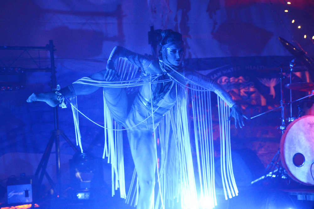 Photo by Megan Pacer/Peninsula Clarion A ballet dancer performs with Quixotic on Sunday, Aug. 7, 2016 at Salmonfest in Ninilchik, Alaska. Quixotic is a cirque nouveau that blends live music with dance, lights and other performance art.