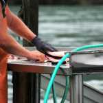 Caleb Wohlers holds up the salmon he caught during the Kenai River Sportfishing Association's Junior Classic event Wednesday, Aug. 10, 2016 in Soldotna, Alaska.