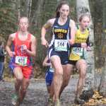 Photo by Joey Klecka/Peninsula Clarion Homer runner Megan Pitzman (544) races with Seward's Ruby Lindquist (703) and ACS's Elizabeth Balsan (408) Oct. 3, 2015, at the Class 1-2-3A state cross-country running championships on the Bartlett High School trails.