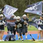 Photo by Jeff Helminiak/Peninsula Clarion Soldotna's Wendell Tuisaula leads Soldotna back onto Justin Maile Field for the second half against West on Friday.