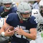 Photo by Jeff Helminiak/Peninsula Clarion Soldotna's Austin Schrader plows ahead for more yards against West on Friday at Justin Maile Field in Soldotna.