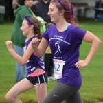 Photo by Joey Klecka/Peninsula Clarion Jacynne Collver (412) runs side by side with Luthien Collver in Saturday's Run for Women 5K race in Kenai.