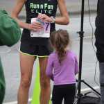 Photo by Joey Klecka/Peninsula Clarion Women's 10K race winner Angie Voight catches her breath as her niece looks on Saturday at the Run for Women in Kenai.