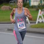 Photo by Joey Klecka/Peninsula Clarion Rena Anderson hustles to a runner-up finish in the 5K race at the Run for Women Saturday morning in Kenai.