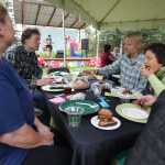 Photo by Kelly Sullivan/ Peninsula Clarion Attendees of the Farm to Table Supper event chow down on menu items made 100 percent from local ingredients by the Willow King, owner of the Where It's At! food bus, and her team of cooks for the Kenai Local Food Connection's third annual Harvest Moon Festival on Sunday, Aug. 14, 2016 in Soldotna, Alaska.