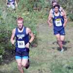 Photo by Jeff Helminiak/Peninsula Clarion Soldotna sophomore Jeremy Kupferschmid leads Homer's Luca Fasulo, Homer's Dexter Lowe and Soldotna's Lance Chilton early in the freshmen-sophomore boys race. Lowe would win the race.