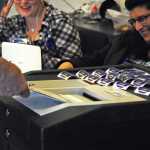Photo by Elizabeth Earl/Peninsula Clarion Election workers chat with a voter as he files his ballot during the primary election Tuesday, Aug. 16, 2016 at Nikiski Fire Station 1 in Nikiski, Alaska.