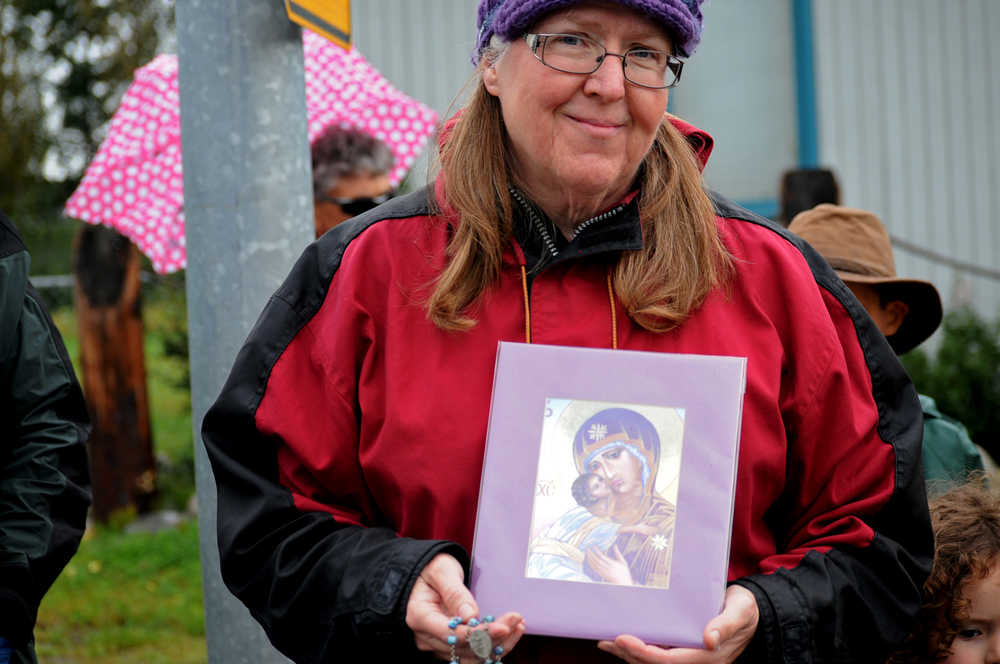 Photo by Elizabeth Earl/Peninsula Clarion Carolyn Boselo gathered with a number of other Catholic Church members near the Planned Parenthood clinic to pray Wednesday, Aug. 17, 2016 in Soldotna, Alaska. It wasn't a protest, Boselo said. "We're just coming here to pray," she said.