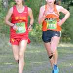 Photo by Jeff Helminiak/Peninsula Clarion West Valley's Kendall Kramer and West's Molly Gellert run together just over two kilometers into the Tsalteshi Invitational at Tsalteshi Trails on Saturday. Kramer would pull away from Gellert for the victory.