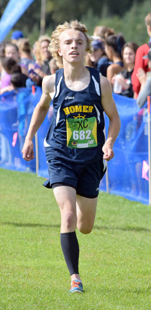 Photo by Jeff Helminiak/Peninsula Clarion Homer's Jacob Davis finishes 16th in the boys race at the Tsalteshi Invitational on Saturday at Tsalteshi Trails.