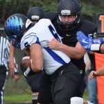 Photo by Joey Klecka/Peninsula Clarion Nikiski linebacker Nick Braswell tackles Thunder Mountain running back Roy Tupou Saturday afternoon at Nikiski High School.