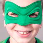 Brooklyn Stewart, 8, is all smiles as the Green Lantern before the start of Saturday's CASA Superhero 5-kilometer run/walk. The Superhero Race was his first 5k.
