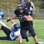 Photo by Joey Klecka/Peninsula Clarion Nikiski senior Patrick Perry takes a handoff from Ian Johnson in a nonconference game against Thunder Mountain Saturday, Aug. 20, at Nikiski High School.