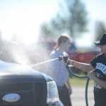 Photo by Kelly Sullivan/ Peninsula Clarion Diamond Dance Project dancers held a fundraiser carwash Sunday, Aug. 28, 2016 in Kenai, Alaska, to help get everyone to the NUVO Dance Convention in September. The group will also host another open house fundraiser from 1-5 p.m., Sept. 18 at the studio on Kalifornsky Beach Road.