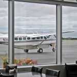 A plane waits on the tarmac outside the windows of Double O Express on Tuesday, Aug. 23, 2016 at the Kenai Airport in Kenai, Alaska. Double O Express, a restaurant known for its burgers, recently moved from its location next to the Bow Bar in Old Town Kenai to a brick-and-mortar location at the Kenai Airport that used to house Odie's Deli.