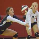 Photo by Joey Klecka/Peninsula Clarion Homer senior MaryHana Bowe digs a serve from Kenai Central Tuesday at Cliff Massie Court in Kenai while teammate Izabelle Hagge (21) looks on.