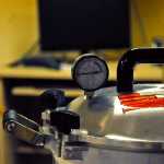 Photo by Elizabeth Earl/Peninsula Clarion A pressure canner sits on the table at the Kenai Cooperative Extension Service office on Wednesday, Aug. 31, 2016 in Soldotna, Alaska. The Cooperative Extension Service offers instruction on how to can fish at its office and in community classes.